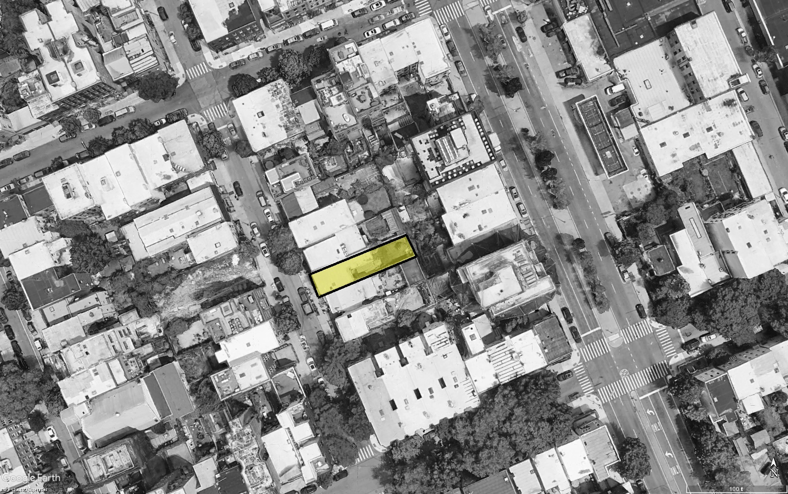 aerial black and white picture with the building site highlighted